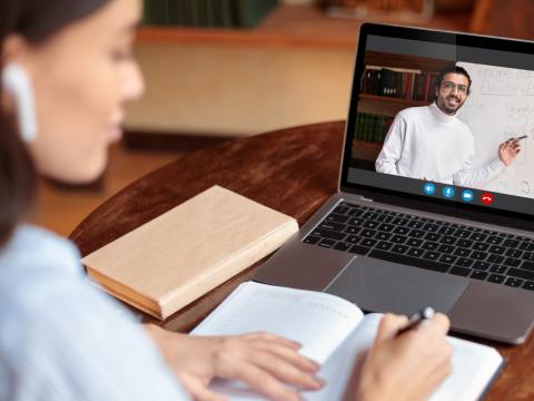 A student watching a recorded lecture online